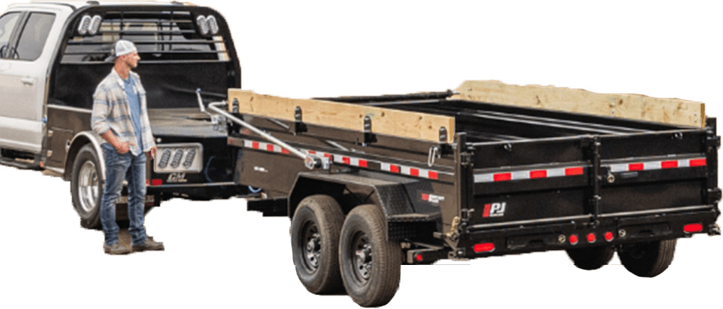 pj trailer attached a truck with a man standing next to it